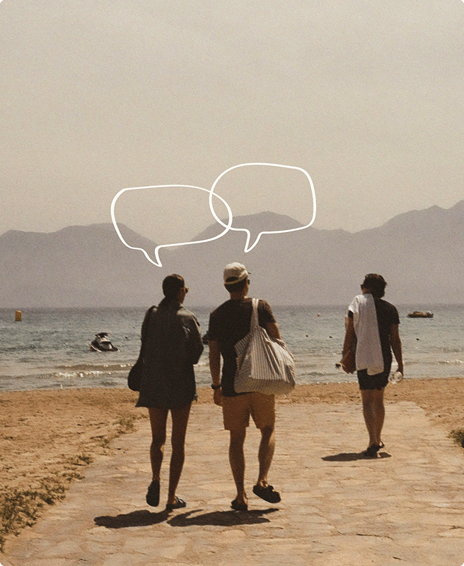 Two people walking down a street